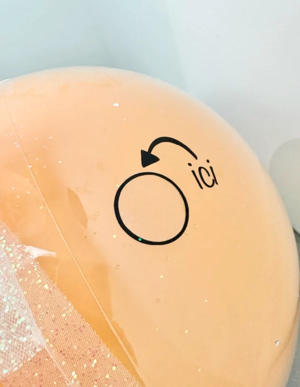 Endroit du ballon où percer pour dévoiler l'annonce